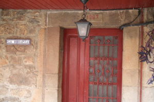 Dintel Casa de La Obra Pía - El Corraldusu, Urbiés